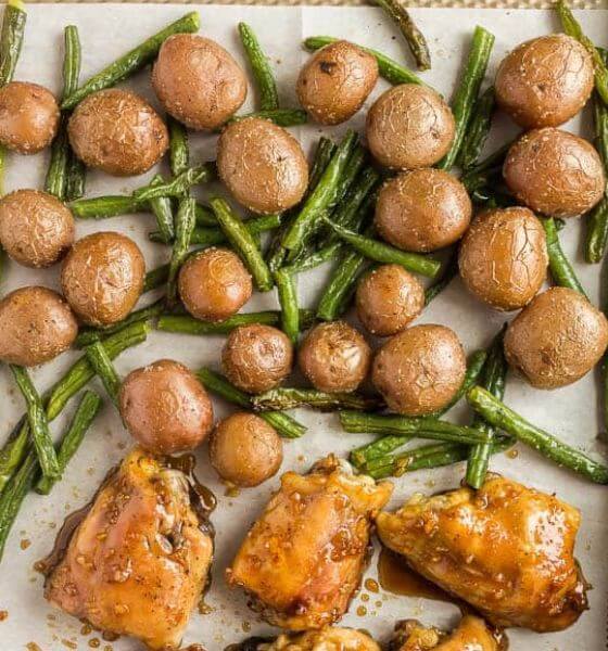 Chicken thighs, potatoes and green beans on a sheet pan