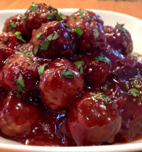 Cranberry sweet and sour meatballs on white plate