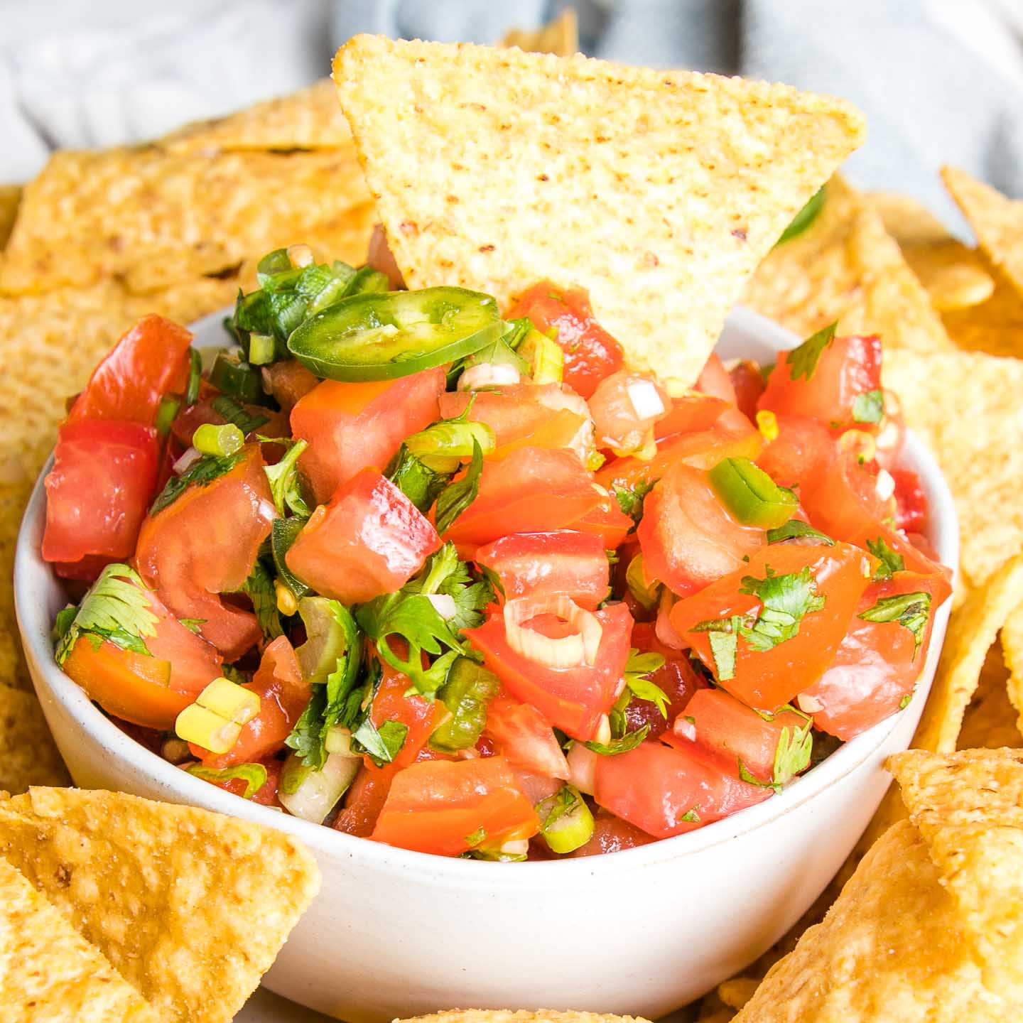 Homemade salsa in white bowl