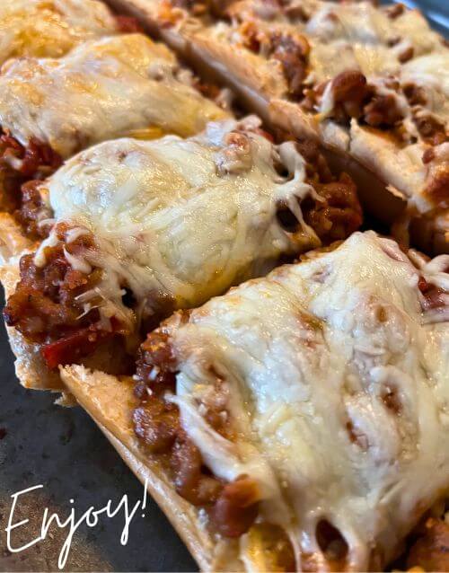 French bread pizza on baking sheet