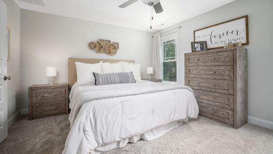 white farmhouse bedroom with wood furniture