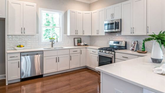 Clean white kitchen with wood floors