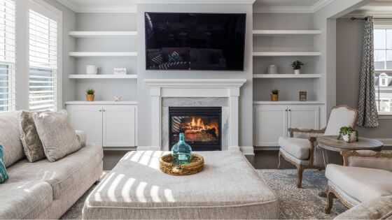 White living room with fireplace and TV