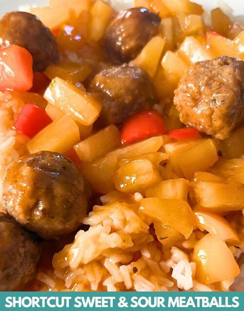 Sweet and Sour meatballs over white rice on plate