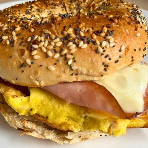 Cheesy Everything Bagel Breakfast Sandwich on white plate