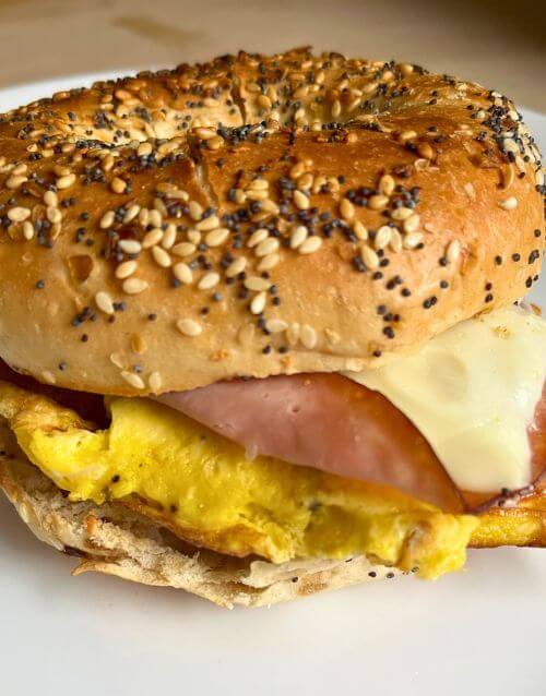 Cheesy Everything Bagel Breakfast Sandwich on white plate