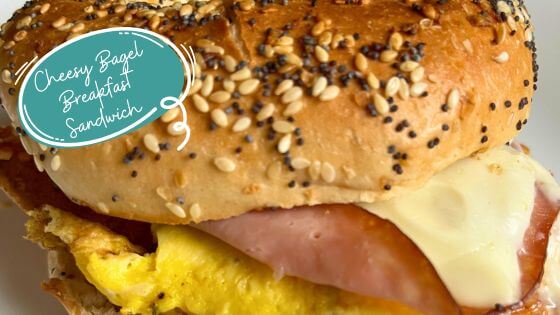 Bagel breakfast sandwich on white plate