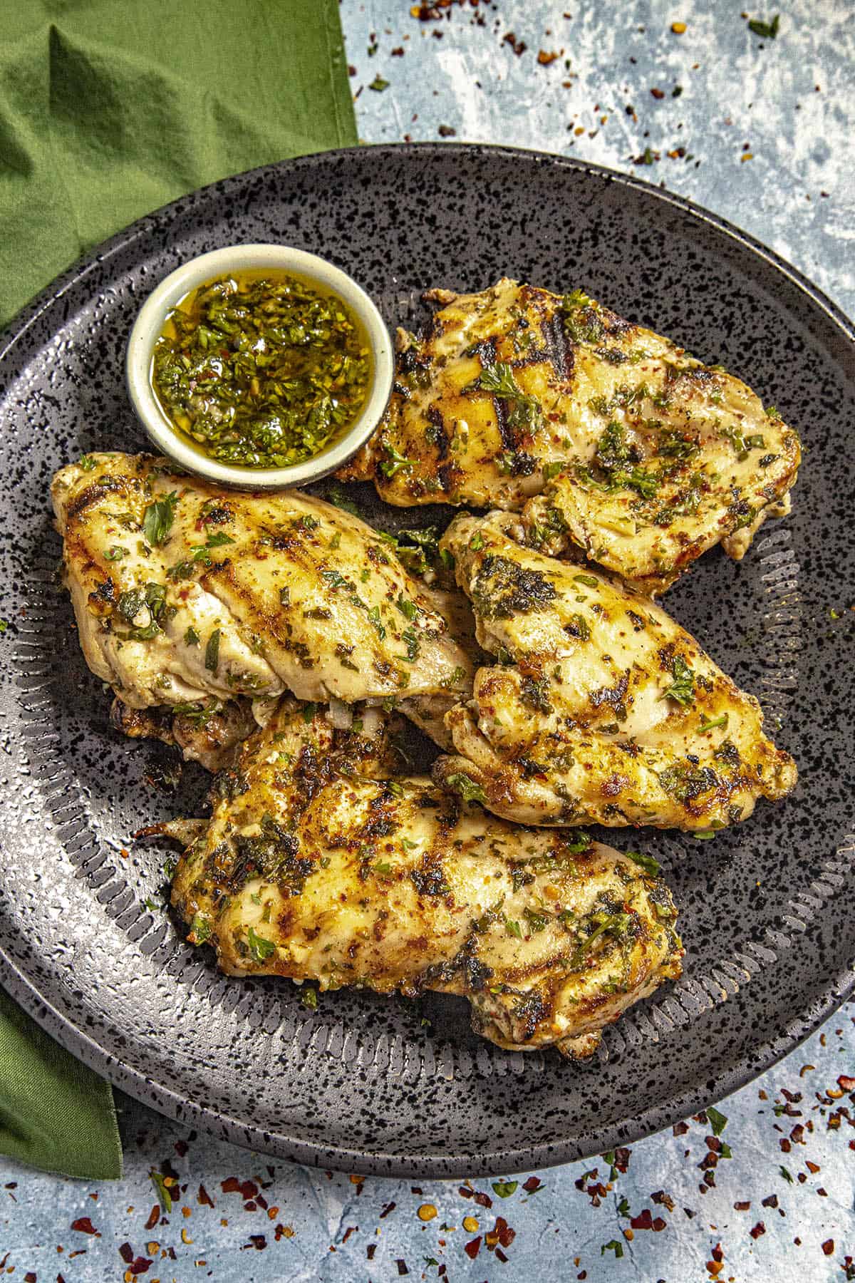 Chicken breasts on black plate