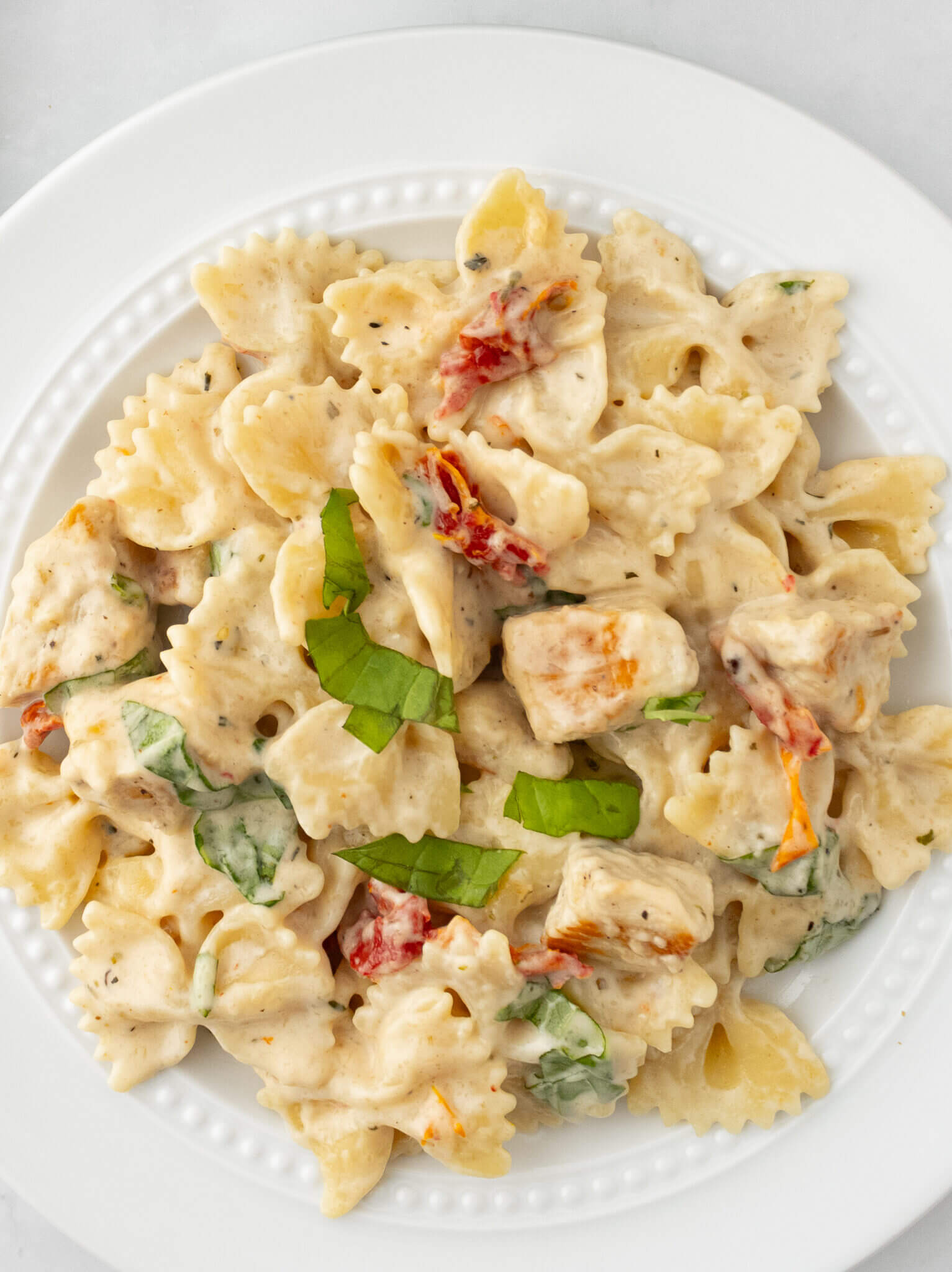 Chicken pasta on white plate