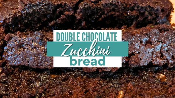 Sliced chocolate zucchini bread with text