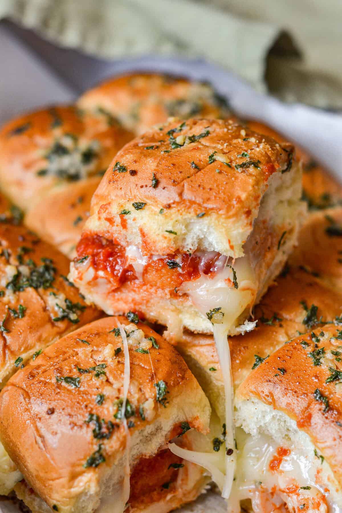 Chicken sliders with sauce and cheese