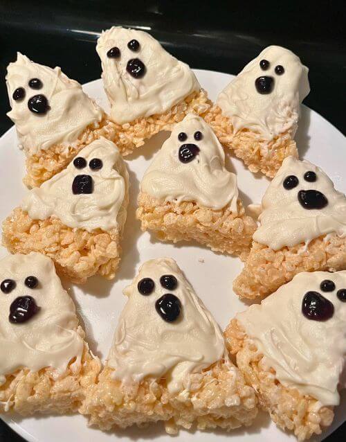 Rice Krispie treat ghosts on a white plate