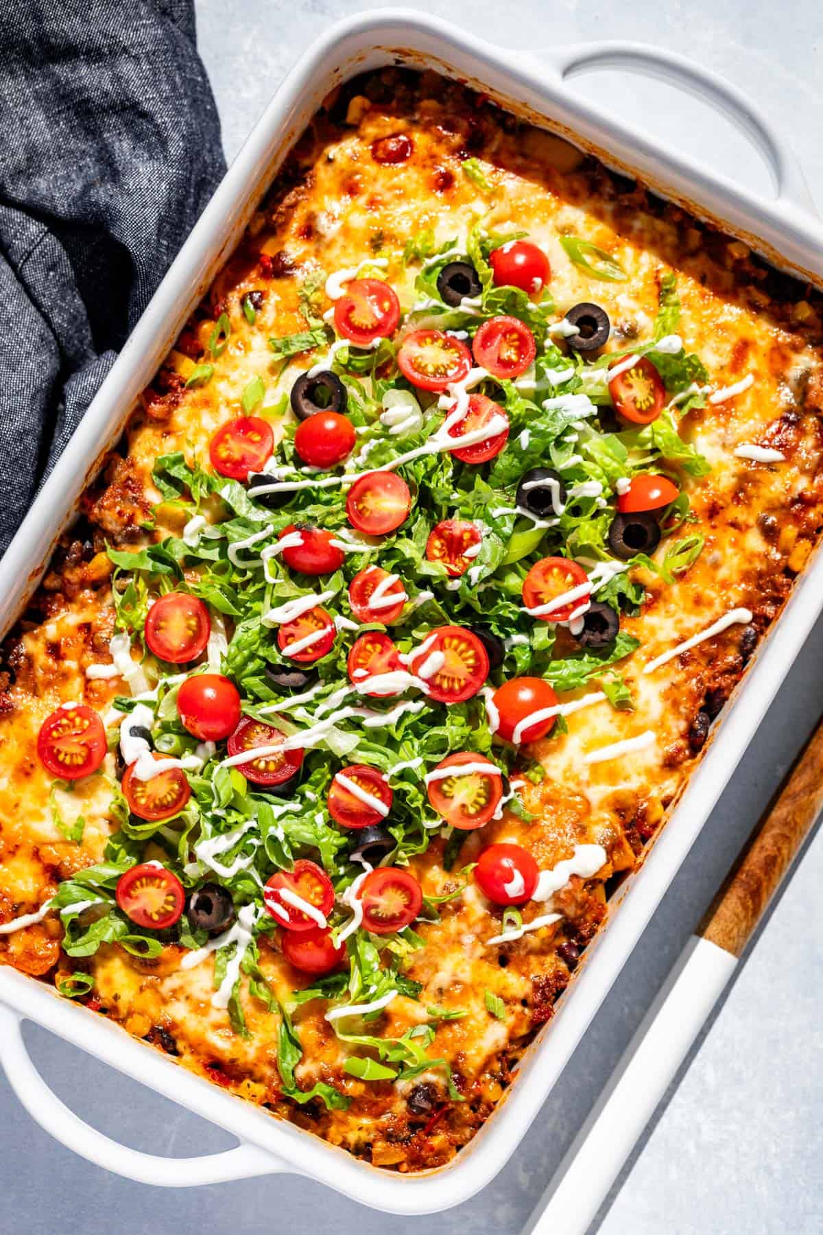 taco casserole in white baking dish