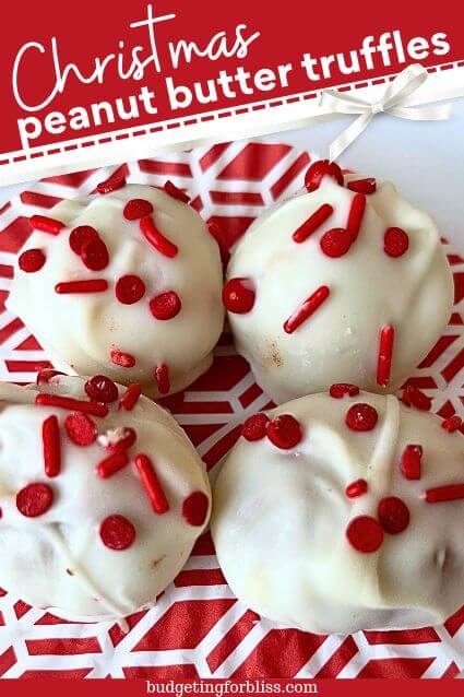 Peanut Butter Truffles covered in white chocolate with red sprinkles
