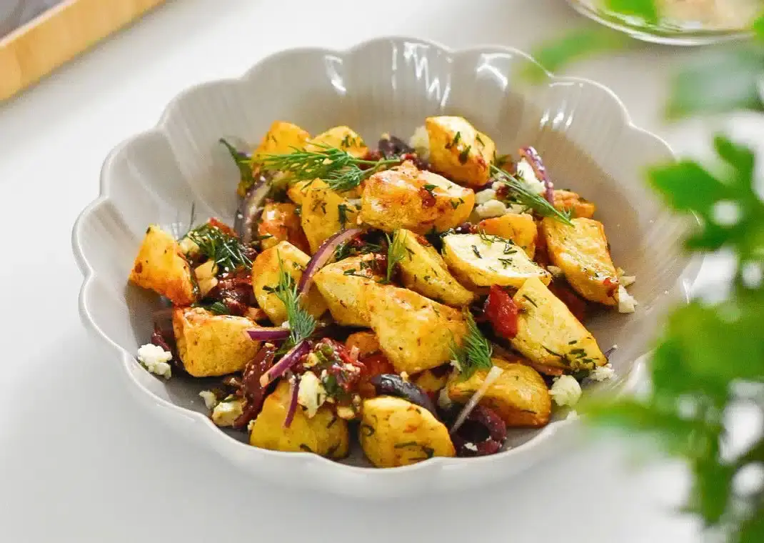 Potato salad in white bowl